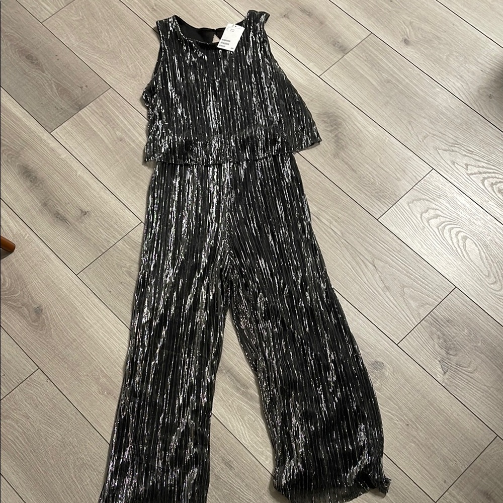 H&M Silver Shimmer Jumpsuit with Elegant Wide-Leg Design. Women’s XS or Youth L